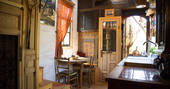 Fully equipped kitchen and dining area inside The Little Wooden House in Malaga Spain